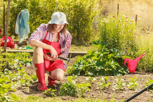 Gardeners Shadwell recycling green waste in a sustainable urban garden